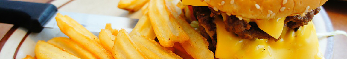 Eating Burger Fast Food at Nick's Burgers restaurant in Redlands, CA.